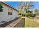 The home's exterior is enhanced by brick pathways, lush landscaping, and a well-manicured lawn at 2823 Clubhouse Dr, Plant City, FL 33566