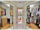 Hallway with mirrored closet doors leads to a bedroom overlooking the pool at 2823 Clubhouse Dr, Plant City, FL 33566