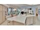 Spacious kitchen featuring white cabinets, a large island, and views of the pool at 2823 Clubhouse Dr, Plant City, FL 33566