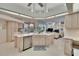 Bright, open kitchen with a central island and views into the living room at 2823 Clubhouse Dr, Plant City, FL 33566