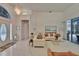 Bright and spacious living room with tile flooring, large windows, and views to the lanai at 2823 Clubhouse Dr, Plant City, FL 33566