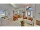 Bright living room and dining room combination with elegant chandeliers and tile flooring at 2823 Clubhouse Dr, Plant City, FL 33566