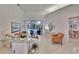Bright living room featuring sliding glass doors that open to a patio and pool view at 2823 Clubhouse Dr, Plant City, FL 33566