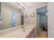 Bright bathroom featuring a vanity with ample counter space and neutral colored walls at 3017 Minuteman Ln, Brandon, FL 33511