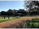 Well-maintained dog park with synthetic turf, benches and gravel paths at 3017 Minuteman Ln, Brandon, FL 33511