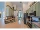 Bright kitchen featuring stainless steel appliances, a double sink, and light green cabinetry at 3017 Minuteman Ln, Brandon, FL 33511