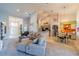 Spacious living room with vaulted ceilings and a seamless flow into the kitchen and dining areas at 3017 Minuteman Ln, Brandon, FL 33511