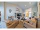 Spacious living room with vaulted ceiling, comfortable seating, and a large television at 3017 Minuteman Ln, Brandon, FL 33511