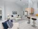 Bright living room features high ceilings, neutral color palette, and an open layout to the rest of the home at 3017 Minuteman Ln, Brandon, FL 33511