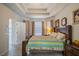 Main bedroom featuring a tray ceiling, carpet, and two large windows with blinds and curtains at 3017 Minuteman Ln, Brandon, FL 33511