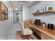 Bright office space with a built-in desk, natural wood tones, a comfortable chair, and ample work area at 3017 Minuteman Ln, Brandon, FL 33511