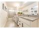 Bathroom featuring double vanity, granite countertop, walk-in shower, and modern fixtures at 31381 Amberview Bend, Wesley Chapel, FL 33545