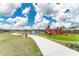Community playground and grass area with playground and walking path at 31381 Amberview Bend, Wesley Chapel, FL 33545