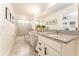 Bathroom features a double vanity, granite counters, and a glass shower door at 31381 Amberview Bnd, Wesley Chapel, FL 33545