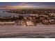 Breathtaking aerial view of beachfront house at sunset overlooking cityscape at 3341 Gulf Of Mexico Dr, Longboat Key, FL 34228