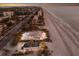 Expansive aerial view of homes on a pristine beachfront, showcasing the beauty of the coastal landscape at 3341 Gulf Of Mexico Dr, Longboat Key, FL 34228