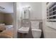 Compact bathroom featuring a sink, toilet and view to a bedroom at 3341 Gulf Of Mexico Dr, Longboat Key, FL 34228