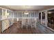 Dining room with wood floors, chandelier lighting, and lots of natural light at 3341 Gulf Of Mexico Dr, Longboat Key, FL 34228