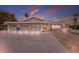 Inviting beachside home featuring a three-car garage and lovely landscaping, perfect for coastal living at 3341 Gulf Of Mexico Dr, Longboat Key, FL 34228