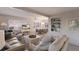Bright living room with white decor, comfortable seating area and direct access to dining room at 3341 Gulf Of Mexico Dr, Longboat Key, FL 34228