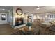 Bright living room with a fireplace, hardwood floors, and comfortable seating area at 3341 Gulf Of Mexico Dr, Longboat Key, FL 34228