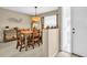 Charming dining room with rustic wooden table and chairs, complemented by neutral tones and stylish decor at 3347 E Dorchester Dr, Palm Harbor, FL 34684