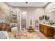 Spacious bathroom with a large shower, soaking tub, double sink, and travertine tile flooring at 4301 W San Luis St, Tampa, FL 33629