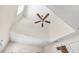 Ceiling features a ceiling fan, window, and unique design in living room at 4301 W San Luis St, Tampa, FL 33629
