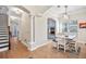 Open-concept dining area with hardwood floors, modern lighting, and views into the kitchen at 4301 W San Luis St, Tampa, FL 33629