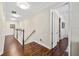 Hallway with wood floors, white walls and trim, and modern lighting at 4301 W San Luis St, Tampa, FL 33629