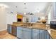 Well-appointed kitchen featuring granite counters, stainless steel dishwasher, breakfast bar, and views to the living area at 4301 W San Luis St, Tampa, FL 33629