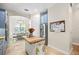 Bright kitchen featuring stainless steel refrigerator, butcher block island, and an open view into the dining area at 4301 W San Luis St, Tampa, FL 33629