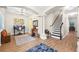 Spacious living area featuring hardwood floors, a staircase, and an adjacent office space at 4301 W San Luis St, Tampa, FL 33629