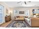 Relaxing living room featuring hardwood floors, stylish decor, and an open view to the modern kitchen area at 4301 W San Luis St, Tampa, FL 33629