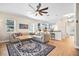 Spacious living room with a large area rug, a comfortable sofa, and an open view to the modern kitchen at 4301 W San Luis St, Tampa, FL 33629