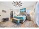 Serene main bedroom features a ceiling fan, ensuite bath, walk-in closet, and ample natural light at 4301 W San Luis St, Tampa, FL 33629