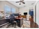 Office with dark hard wood floors, ceiling fan, desk with computer, and big window at 4301 W San Luis St, Tampa, FL 33629