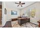 Office with ceiling fan, window, desk with computer, area rug and hardwood floor at 4301 W San Luis St, Tampa, FL 33629