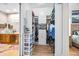 Well-organized walk-in closet featuring custom shelving, drawers, and hanging space for efficient storage solutions at 4301 W San Luis St, Tampa, FL 33629