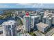 Real estate aerial view shows a condo tower with city and bay views, emphasizing its luxurious urban setting at 449 S 12Th St # 2702, Tampa, FL 33602