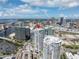 An aerial view displays a condo surrounded by city buildings, highlighting its central location and urban lifestyle appeal at 449 S 12Th St # 2702, Tampa, FL 33602