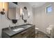 Elegant bathroom with dual sinks, modern lighting, and stylish fixtures at 449 S 12Th St # 2702, Tampa, FL 33602