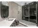 A luxurious bathroom with double sinks, a glass shower enclosure, and stylish tile work throughout the space at 449 S 12Th St # 2702, Tampa, FL 33602