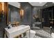Stylish bathroom with marble countertop, gold fixtures, and a modern glass shower at 449 S 12Th St # 2702, Tampa, FL 33602