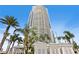 The building is tall with many balconies and a resort-style pool with palm trees in the background at 449 S 12Th St # 2702, Tampa, FL 33602