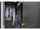 Walk-in closet with built-in shelving, hanging rods, and dark wood finish at 449 S 12Th St # 2702, Tampa, FL 33602