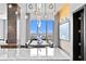 Dining room features a modern chandelier, a large window with city views, and stylish decor at 449 S 12Th St # 2702, Tampa, FL 33602