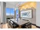 Dining room features a contemporary chandelier, city views, and a modern table setting at 449 S 12Th St # 2702, Tampa, FL 33602