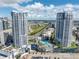 Exterior shot of the building showing a vibrant skyline, resort-style pool, and convenient parking at 449 S 12Th St # 2702, Tampa, FL 33602