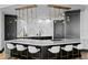 Spacious kitchen island features modern lighting and custom cabinetry at 449 S 12Th St # 2702, Tampa, FL 33602
